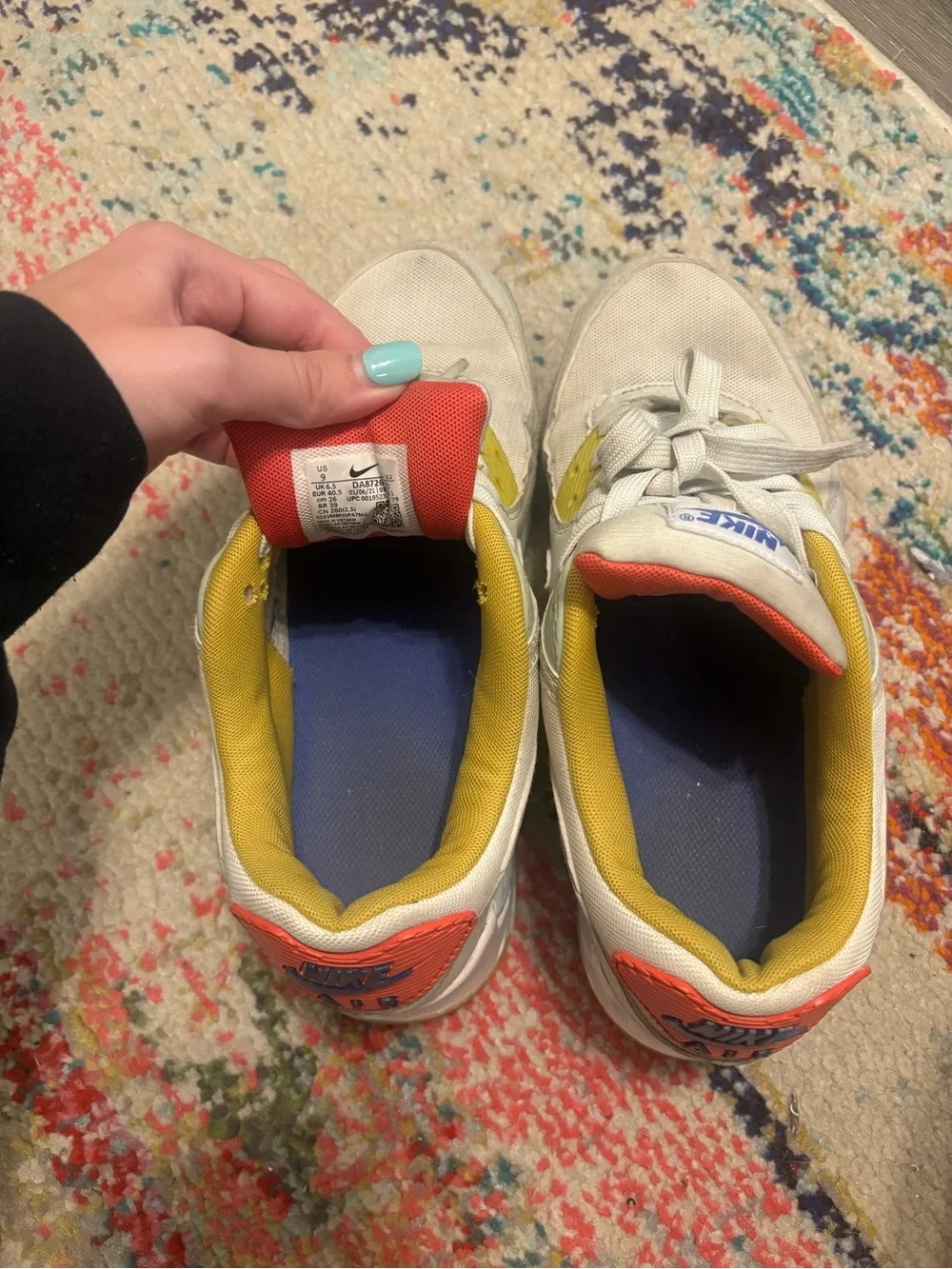 Nike Women's White Sneakers with Blue Swoosh and Yellow Lining